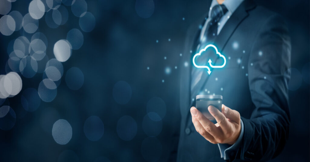 Cloud computing concept - connect smart phone to cloud. Businessman or information technologist with cloud computing icon and smart phone.