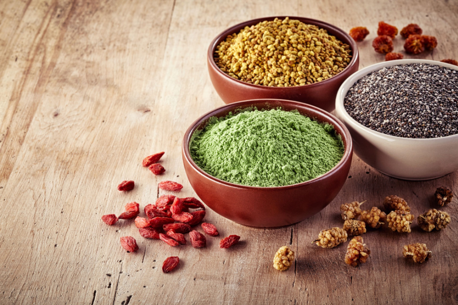 Bowls of various protein on a wooden background