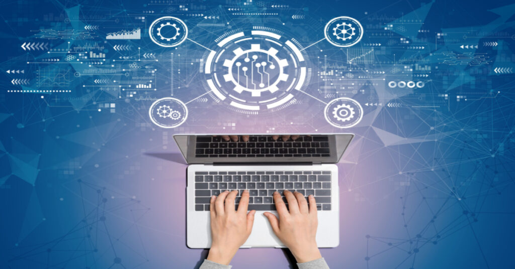 Business Process Automation concept with a person using a laptop computer with just their hands visible on the keyboard